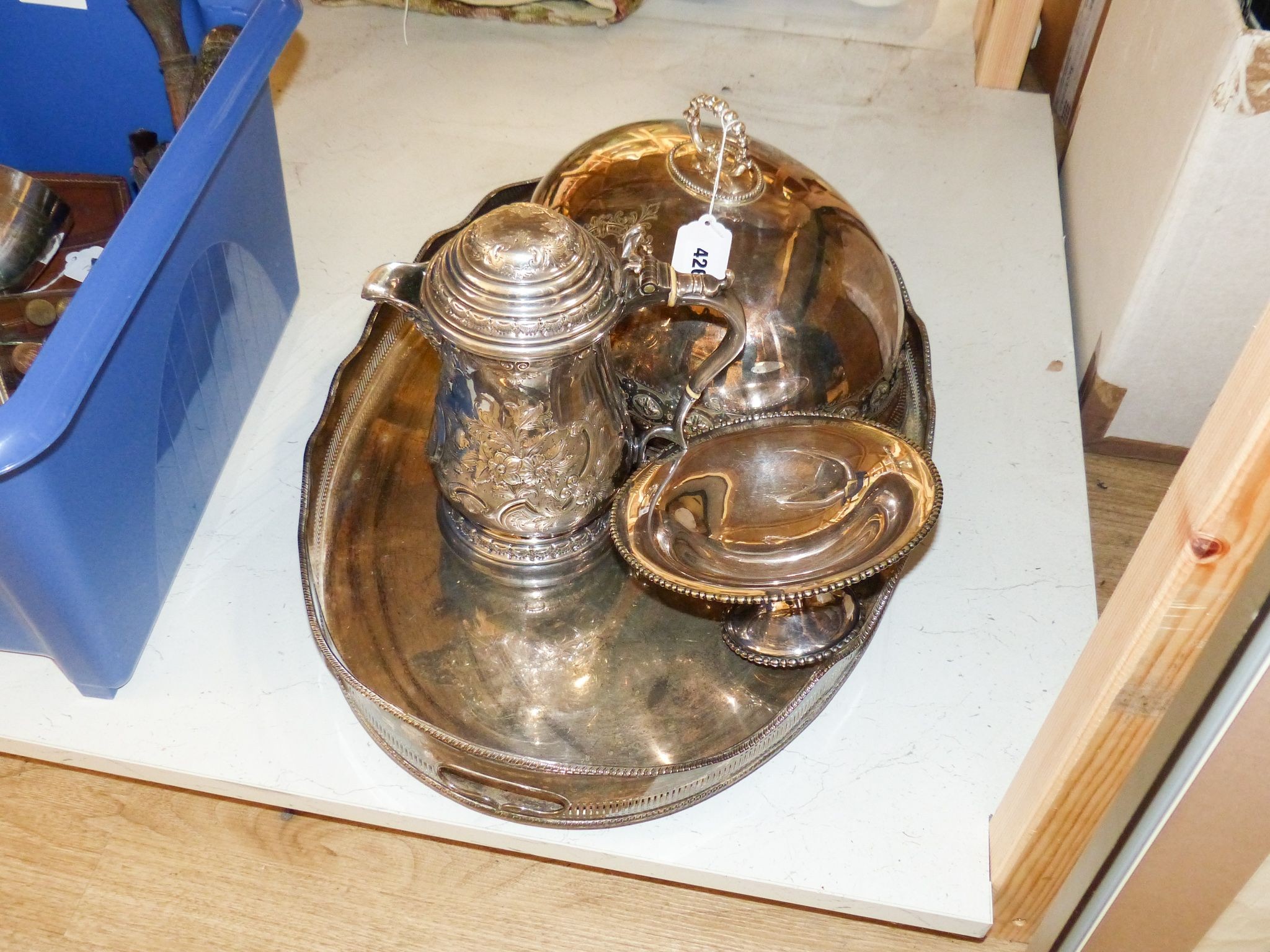 A Victorian embossed silver plated jug, oval tray, meat cover and spoon